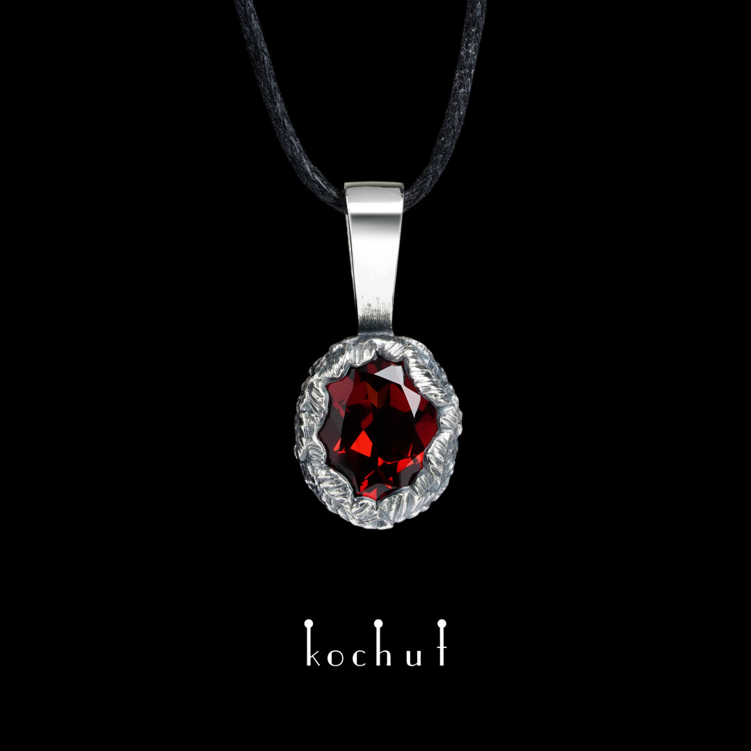 Pendant «The Source of Life». Silver, oxidized, red garnet