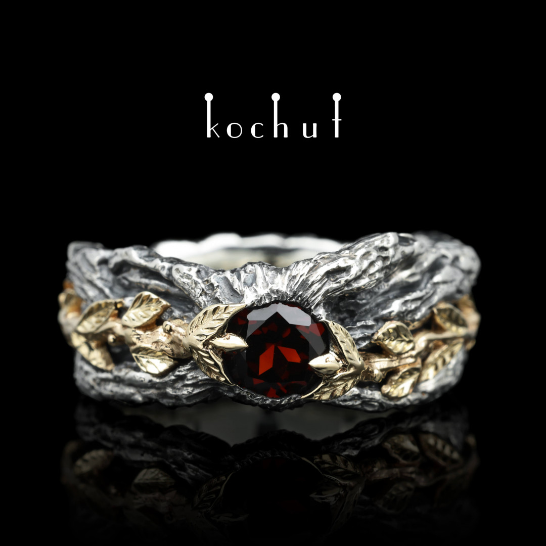 Ring «Power of Life». Silver, yellow gold, red garnet, oxidized