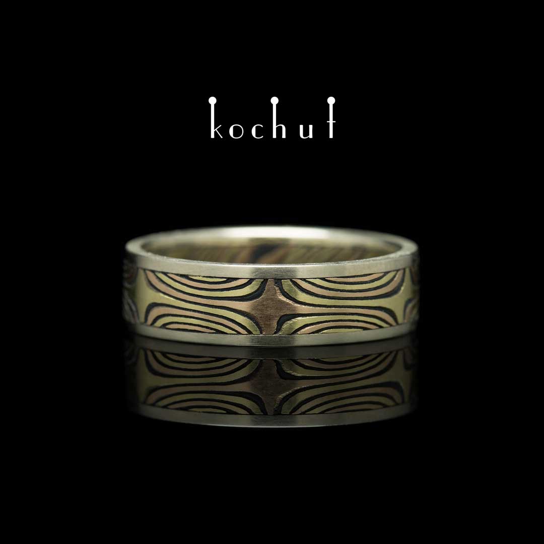 Ring mokume «The shining of the Eastern Stars». White, yellow, red gold, etched silver