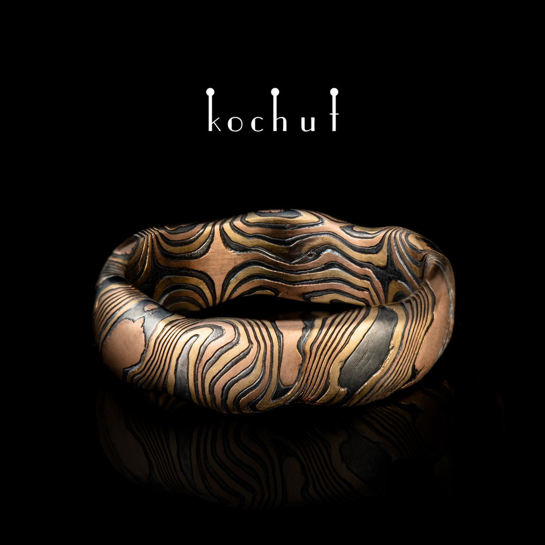 Wedding ring mokume «Waves». Red, yellow gold, etched silver, oxidation