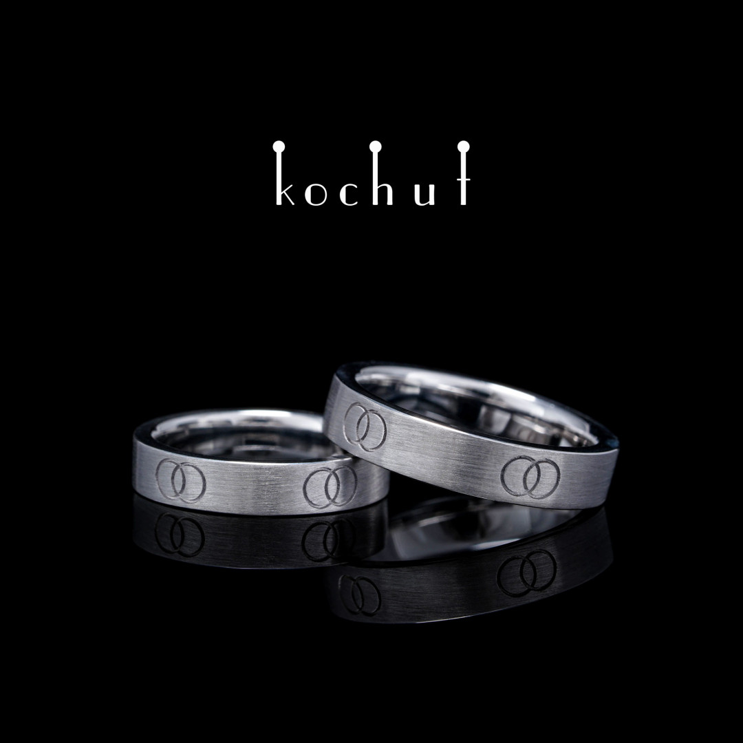 Flat-shaped wedding rings «In unison». Silver, white rhodium