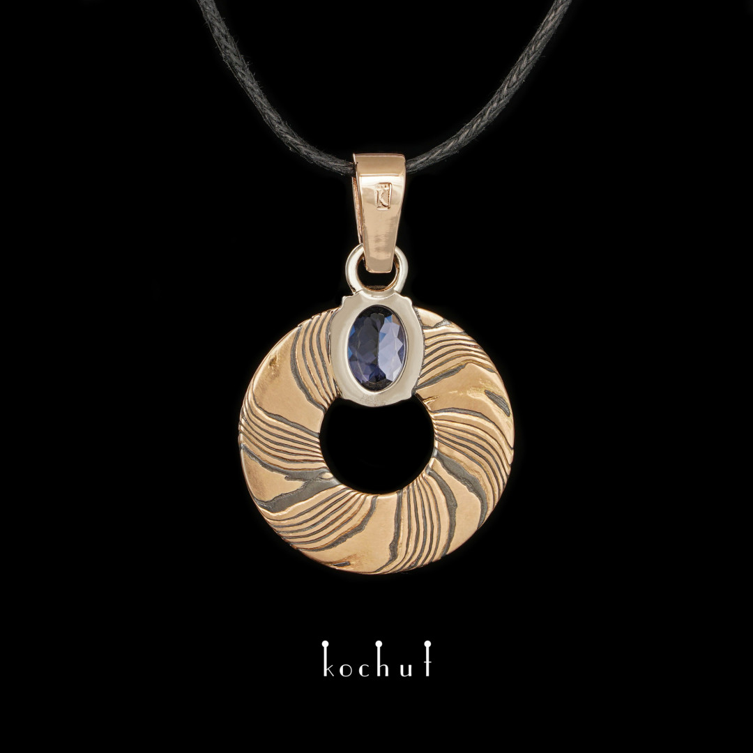 Precious astrolabe — mokume pendant with tanzanite