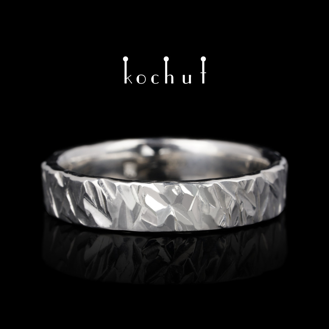 Wedding ring in forging Storm. Silver, white gold