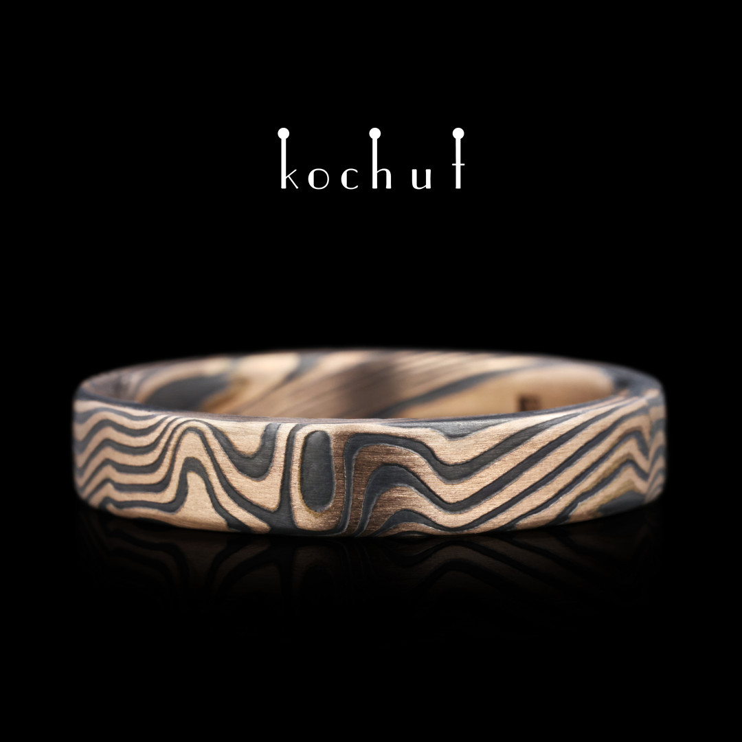 Mokume wedding ring «Kanso». Etched silver, red gold, oxidized