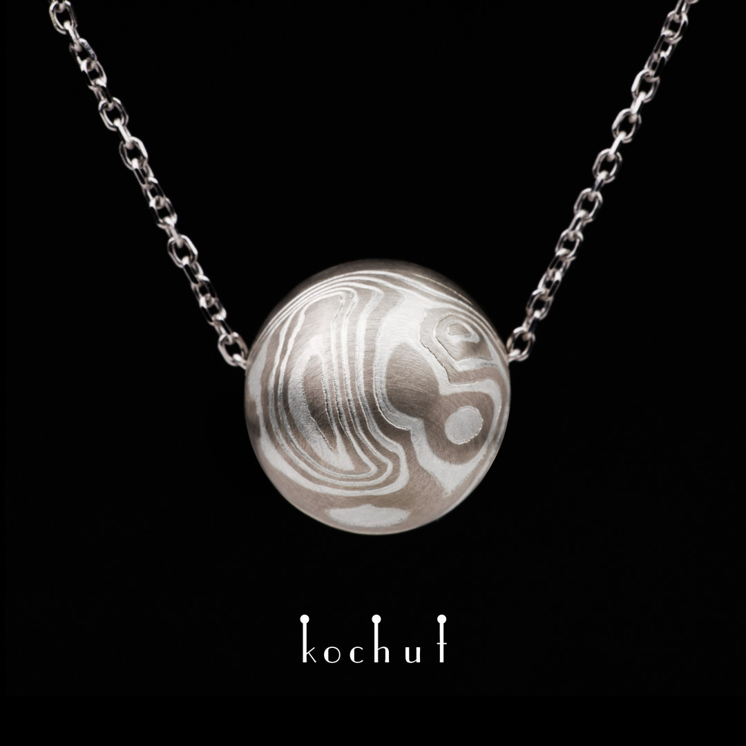 Mokume pendant «Whirlwind». Palladium gold, etched silver